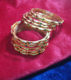 Golden glass bangles with glitters set of 8